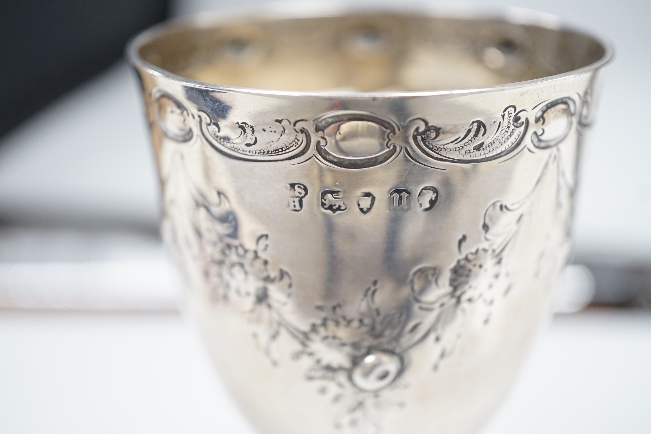 A Victorian embossed silver goblet by Charles Stuart Harris, London, 1875, 14.2cm, 3.3oz.